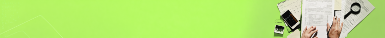 Top-down view of a desk with tax forms, a smartphone, glasses, a magnifying glass, and hands writing on a document on a bright lime-green background.